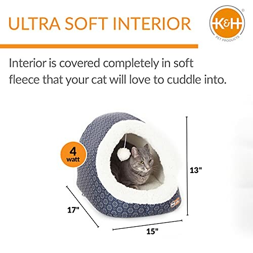 Cat in a soft fleece pet bed with dimensions labeled.