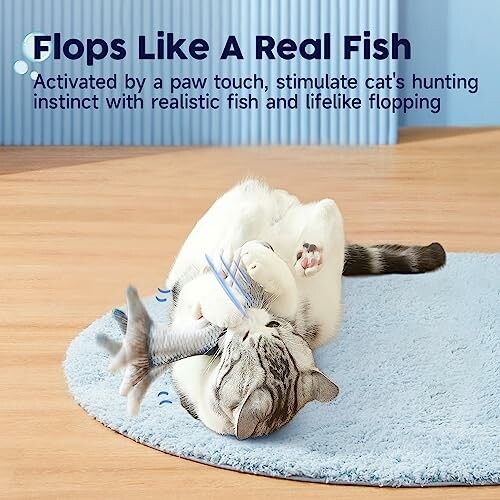 Cat playing with a flopping fish toy on a rug.