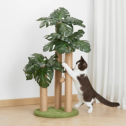 Cat playing with a palm tree-themed scratching post.