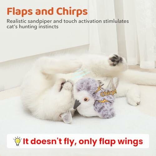 Cat playing with a flapping bird toy indoors.