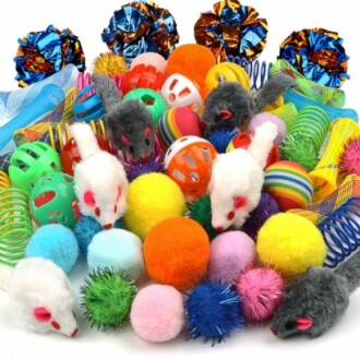 Assorted colorful cat toys including balls, mice, and springs.