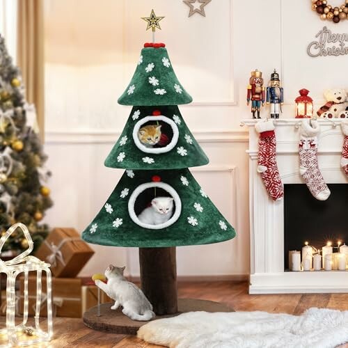 A Christmas tree-shaped cat furniture with two cats in compartments, near festive decor.