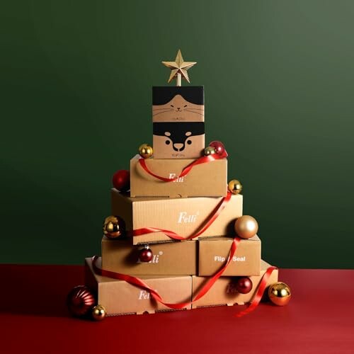 Stack of gift boxes with ribbons and ornaments, topped with a star.