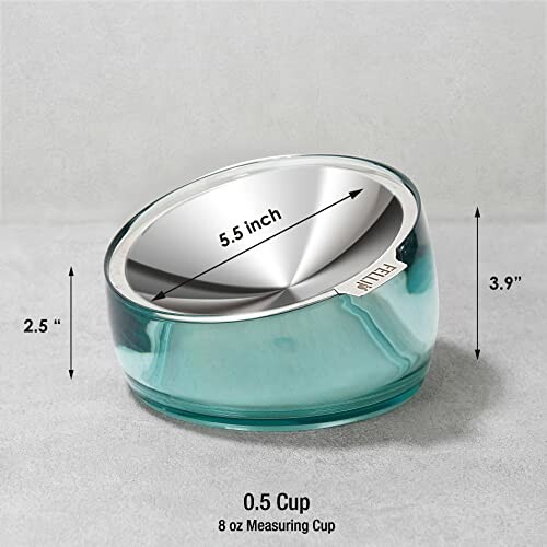 Stylish measuring cup with dimensions shown.