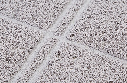 Close-up view of a textured, looped surface with intersecting lines